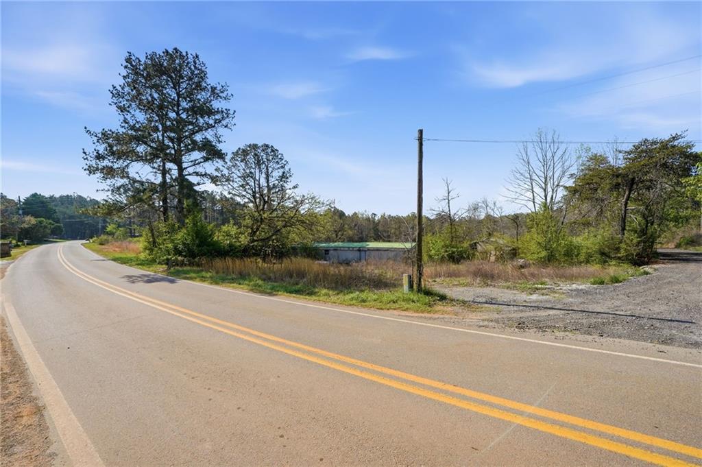 17 Line Crest Drive Ball Ground, GA 30107 - Photo 14 of 18 a view of a road with a building in the background