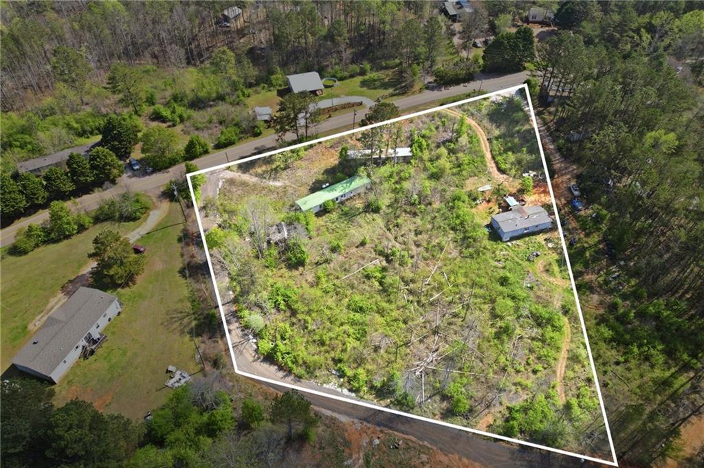 17 Line Crest Drive Ball Ground, GA 30107 - Photo 2 of 18 an aerial view of a yard with plants