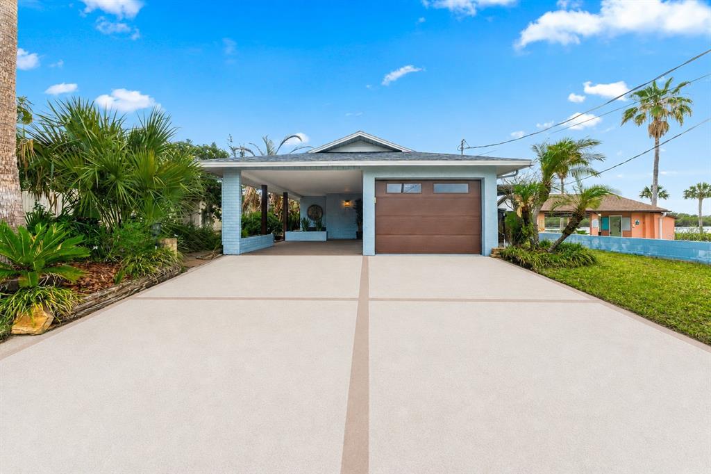 29 Pelican Lane Edgewater, FL 32141 - Photo 1 of 39 a view of a house with a yard and potted plants