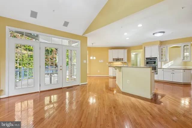 a spacious bathroom with a granite countertop tub sink and mirror