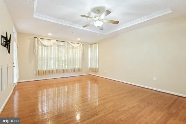 a view of a bathroom with double vanity windows a sink and a mirror