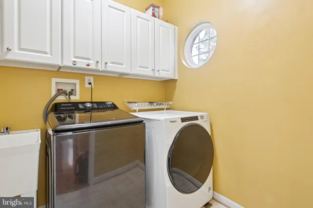 a white toilet sitting next to a bath tub
