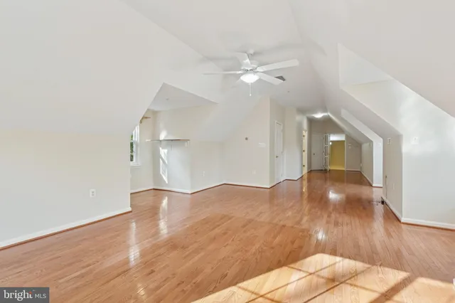 a bathroom with a tub a sink and mirror