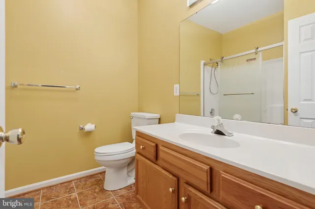 a view of a living room with kitchen and furniture