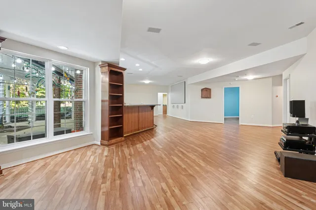 a view of an empty room with glass door