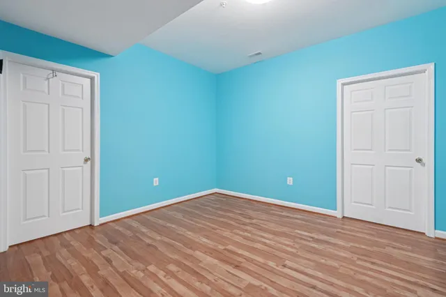 a view of a kitchen with a sink and windows