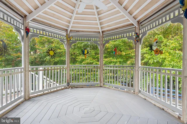 a view of a park with bench and trees