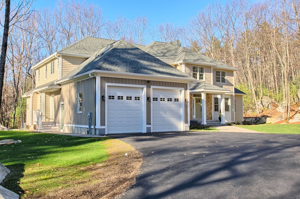 72 Tenney Road Westford, MA 01886 - Photo 3 of 30 a front view of a house with a yard