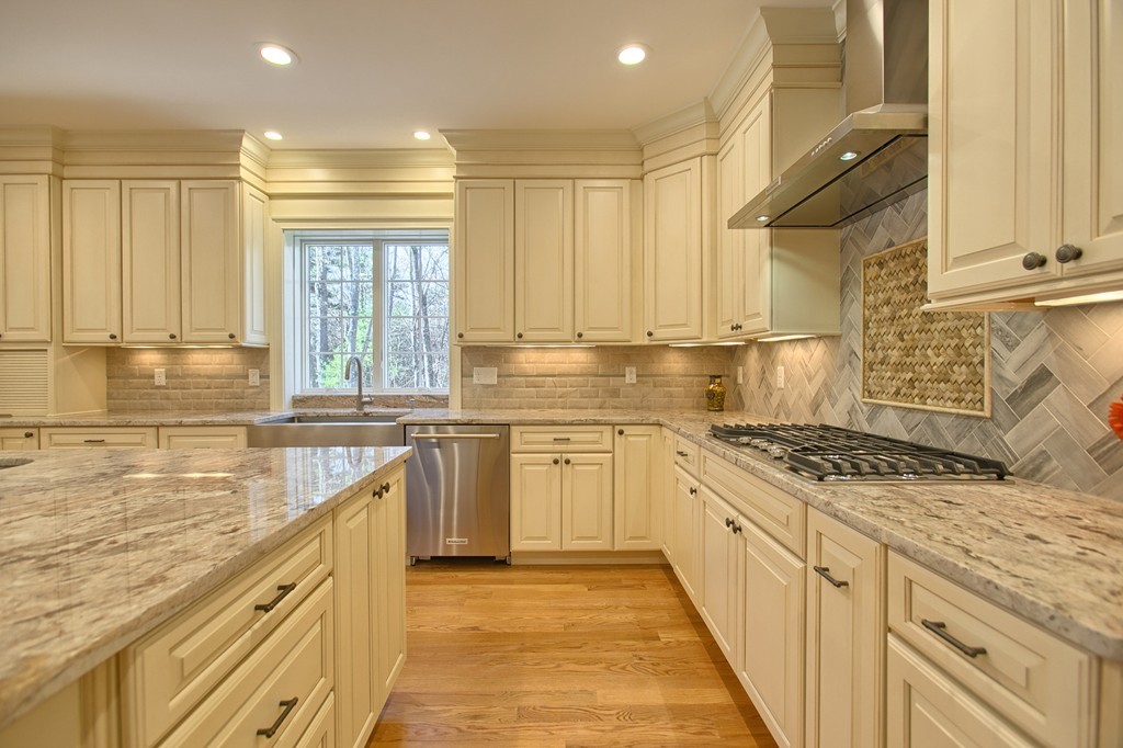 72 Tenney Road Westford, MA 01886 - Photo 9 of 30 a kitchen with stainless steel appliances granite countertop a sink and cabinets