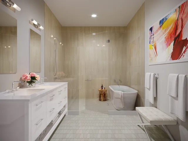 a bathroom with a sink mirror and toilet