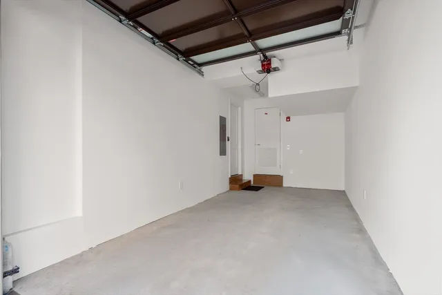 an empty room with a ceiling fan