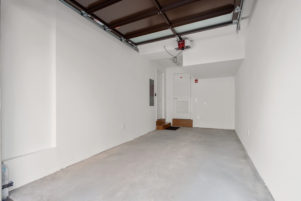 1-17 Edgerly Place, Unit 3 Boston, MA 02116 - Photo 8 of 8 an empty room with a ceiling fan