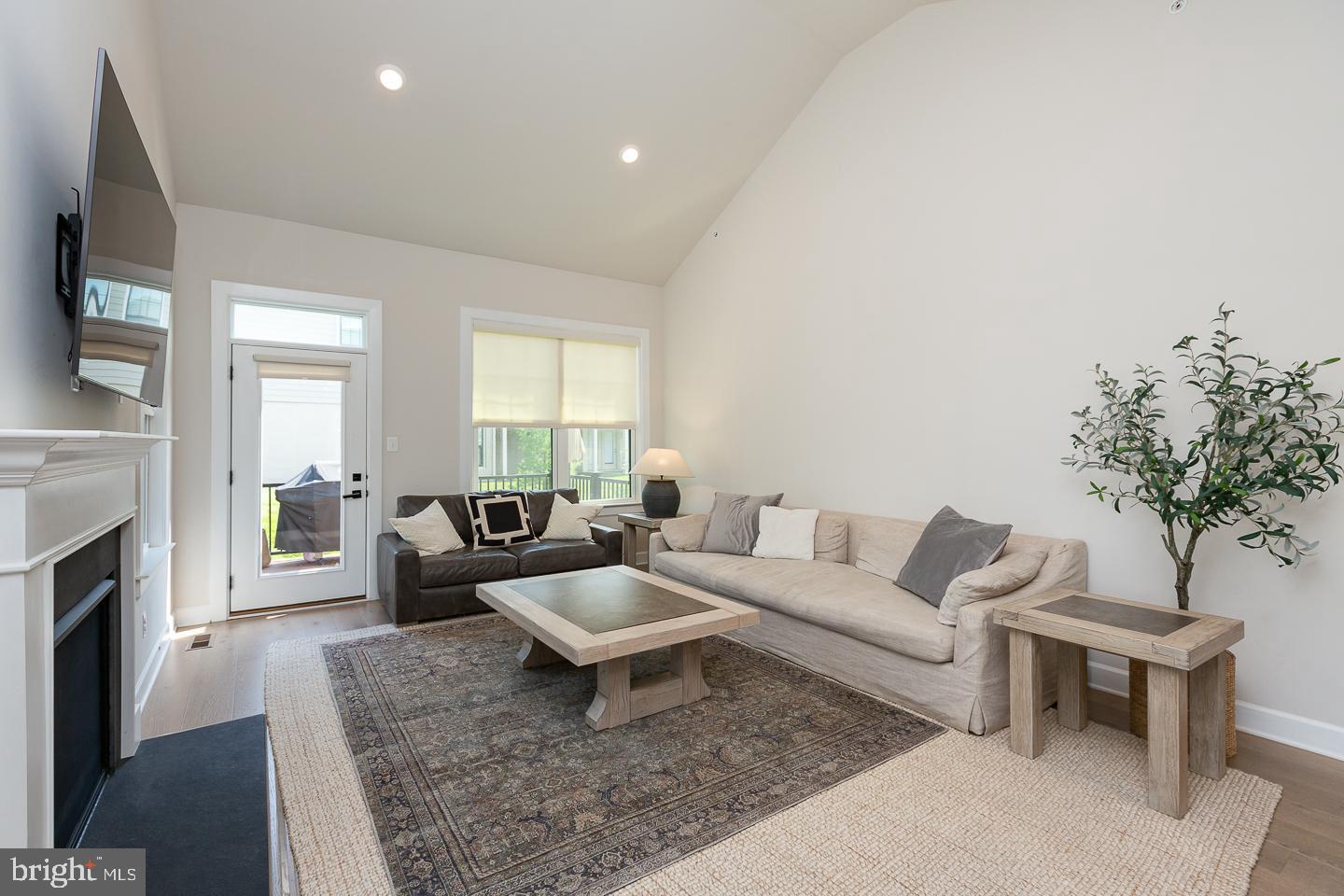 21 The Lane Wayne, PA 19087 - Photo 13 of 57 a living room with furniture and a fireplace