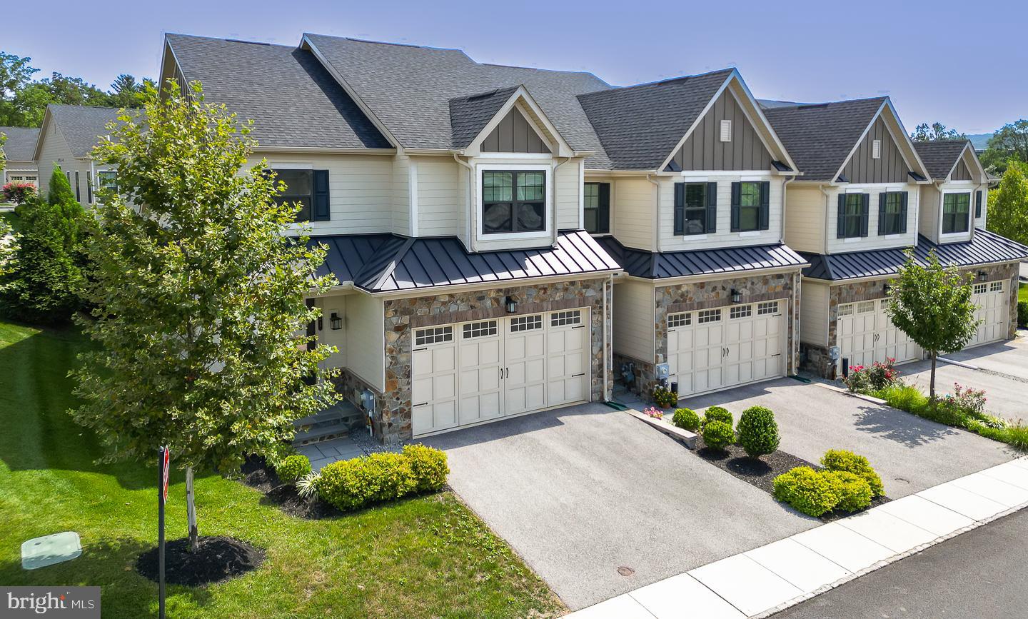 21 The Lane Wayne, PA 19087 - Photo 2 of 57 a front view of house with yard and green space
