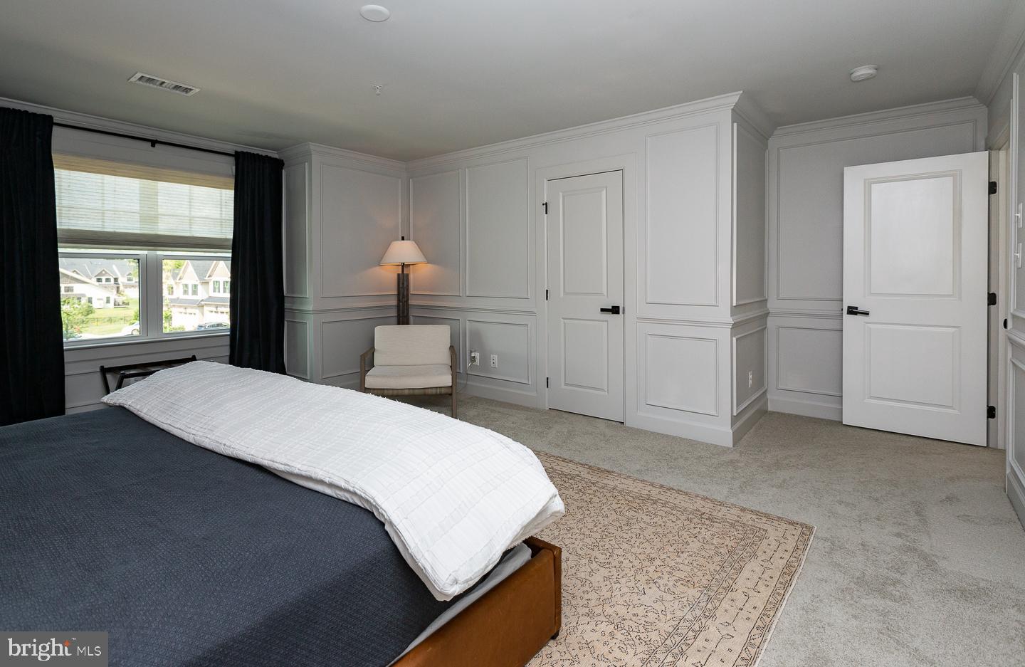 21 The Lane Wayne, PA 19087 - Photo 29 of 57 a spacious bedroom with a bed and a window