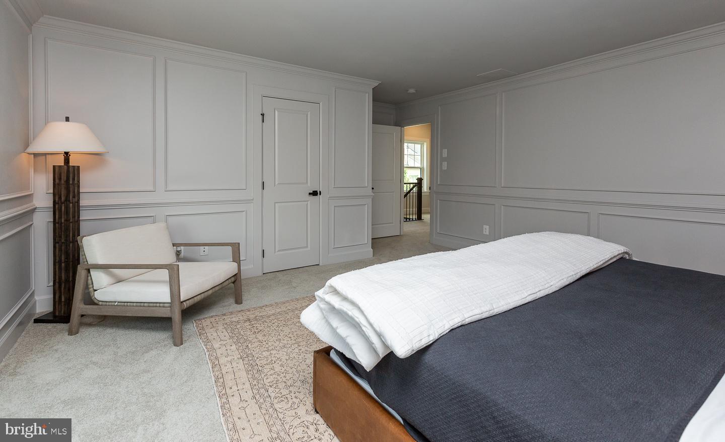 21 The Lane Wayne, PA 19087 - Photo 30 of 57 a bedroom with a bed and a table