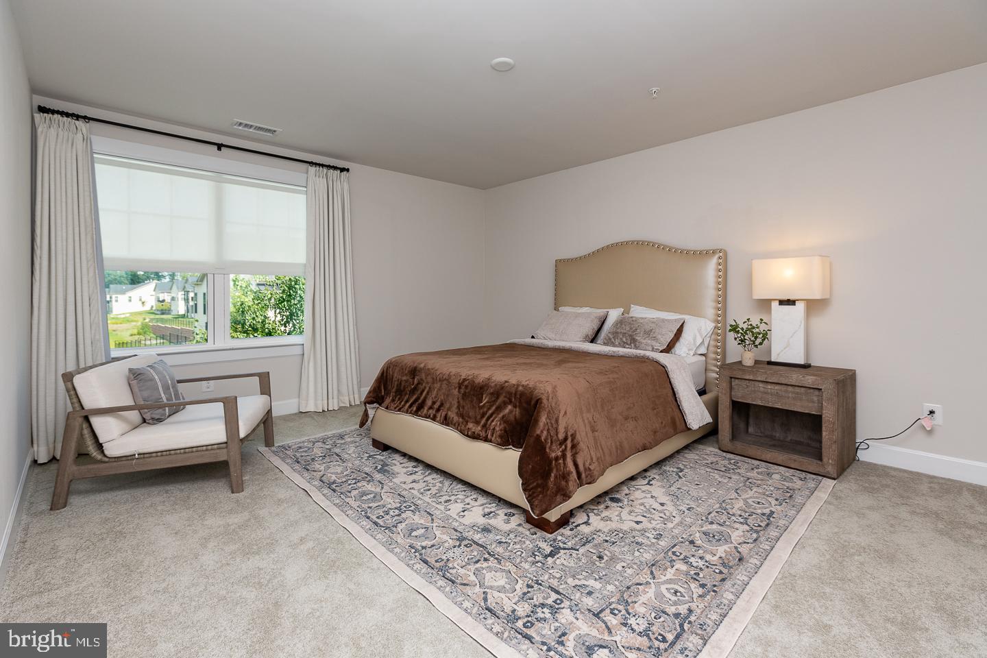 21 The Lane Wayne, PA 19087 - Photo 31 of 57 a bedroom with a bed and a couch