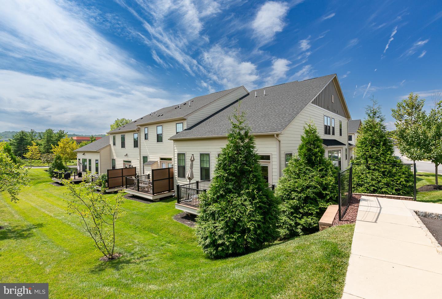 21 The Lane Wayne, PA 19087 - Photo 47 of 57 a view of house with garden and tall trees