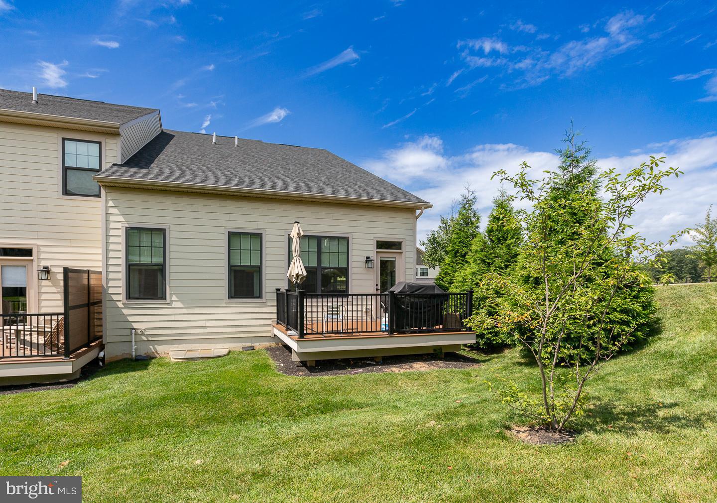 21 The Lane Wayne, PA 19087 - Photo 48 of 57 a view of a house with backyard and sitting area