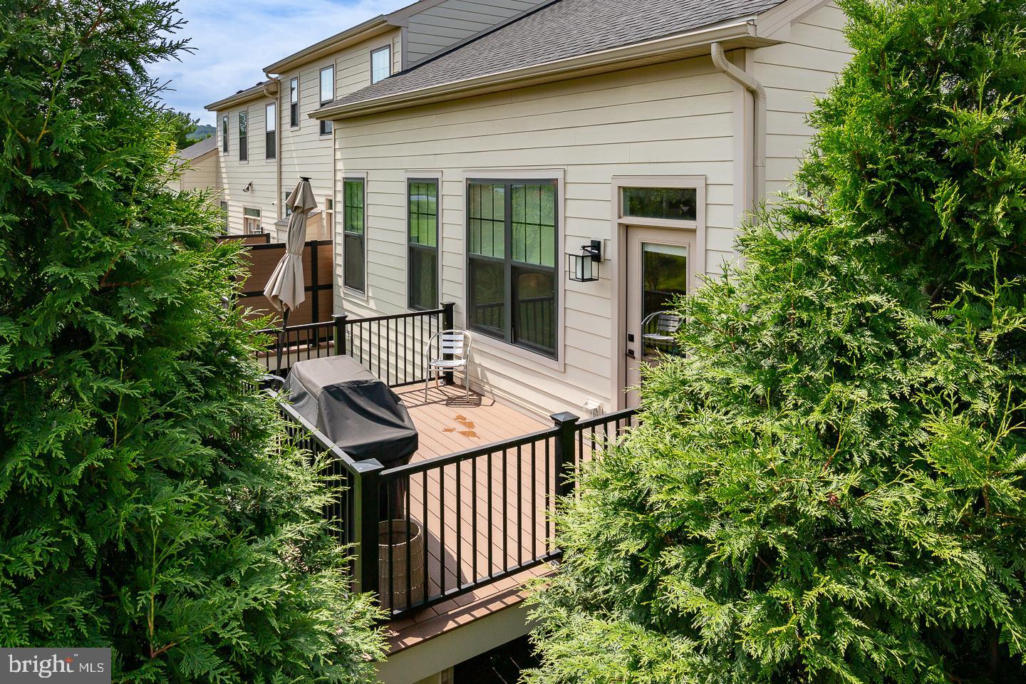 21 The Lane Wayne, PA 19087 - Photo 49 of 57 a backyard of a house with table and chairs
