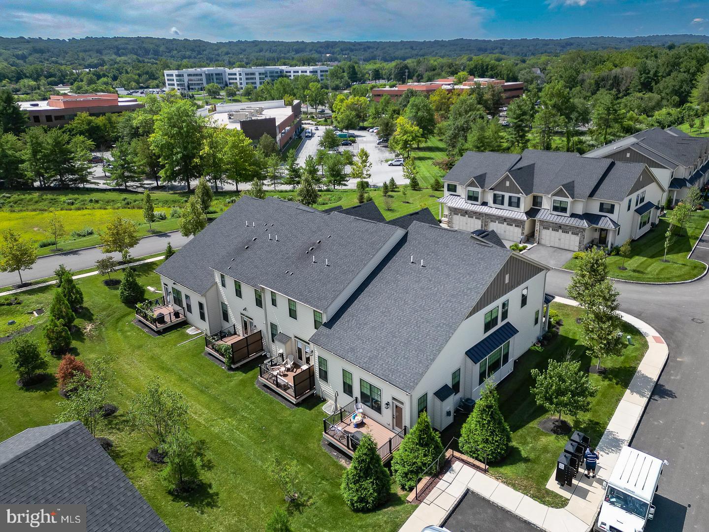 21 The Lane Wayne, PA 19087 - Photo 53 of 57 an aerial view of a house with a garden and lake view