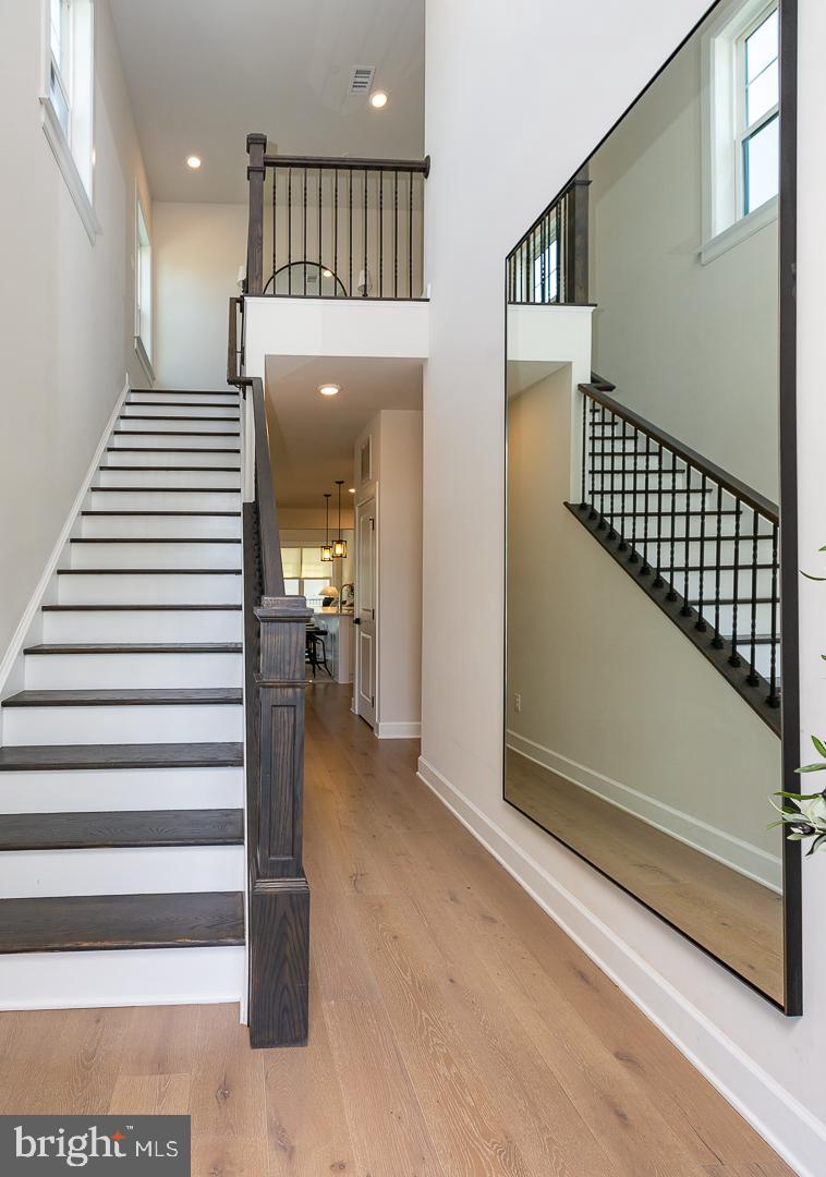 21 The Lane Wayne, PA 19087 - Photo 6 of 57 a view of a hallway with entryway and chandelier