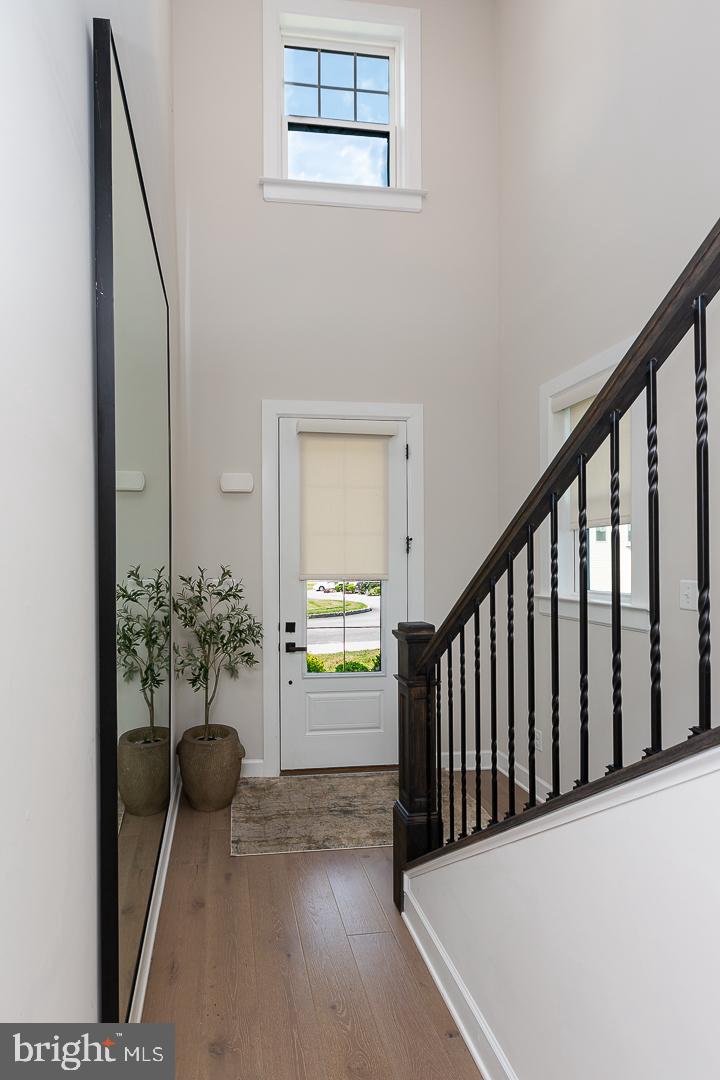 21 The Lane Wayne, PA 19087 - Photo 7 of 57 a view of a hallway and a livingroom with furniture