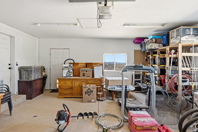 1637 East Midvalley Road Enoch, UT 84721 - Photo 36 of 48 Garage with a garage door opener