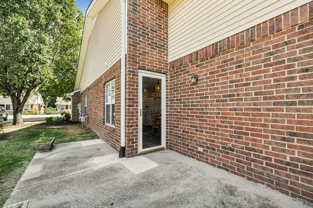 a view of a pathway with a house in the background