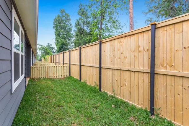 a view of a pathway with a backyard