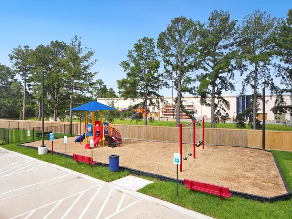 a park view with a sign board