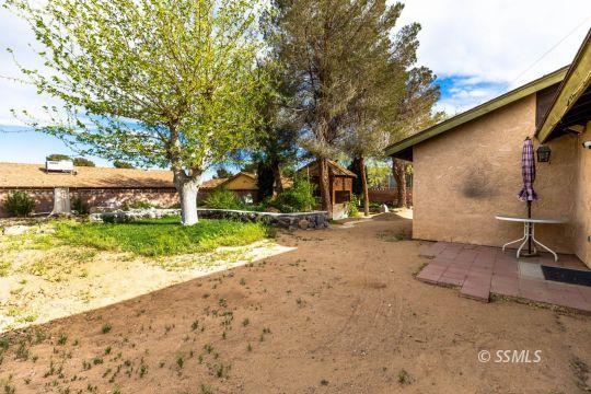 1224 North Inyo Street Ridgecrest, CA 93555 - Photo 24 of 28 a view of a house with a yard