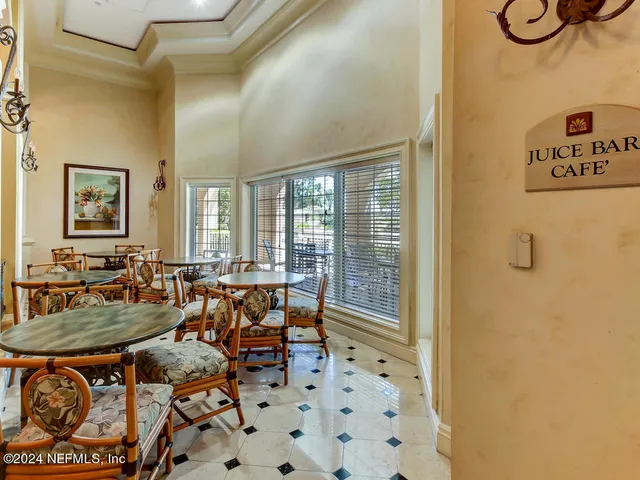 a kitchen with stainless steel appliances granite countertop a refrigerator sink and stove