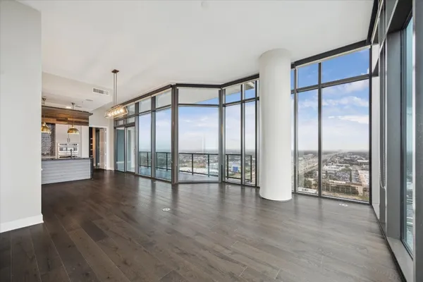 a view of an entryway with wooden floor