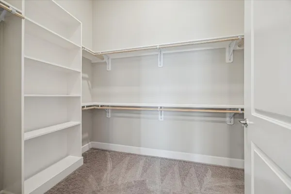 a view of an empty walk in closet