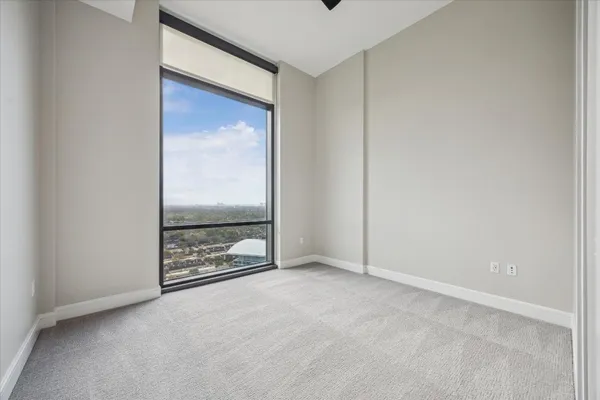 a view of an empty room with a fireplace