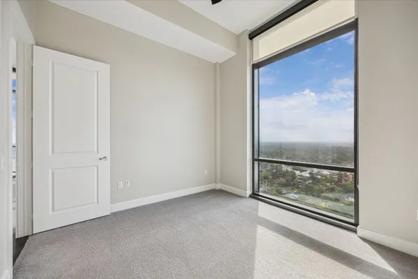 a view of a room that has a large window