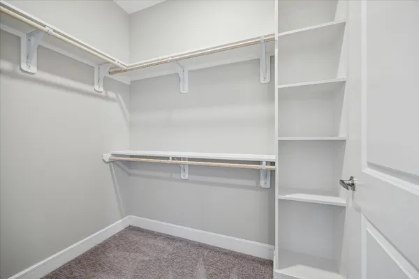 a view of an empty walk in closet