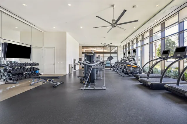 a view of a gym room with gym equipment