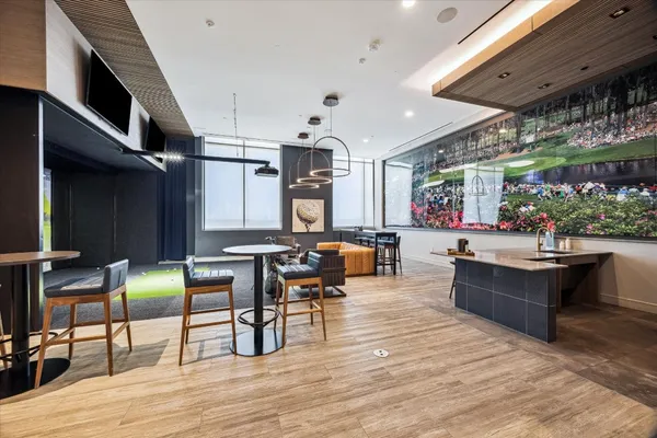 a room with pool table and a floor to ceiling window