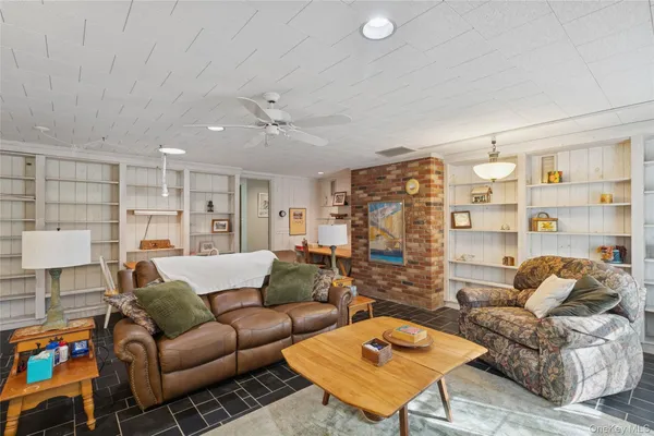 a bathroom with a sink toilet and mirror