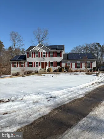 a front view of a building with a road