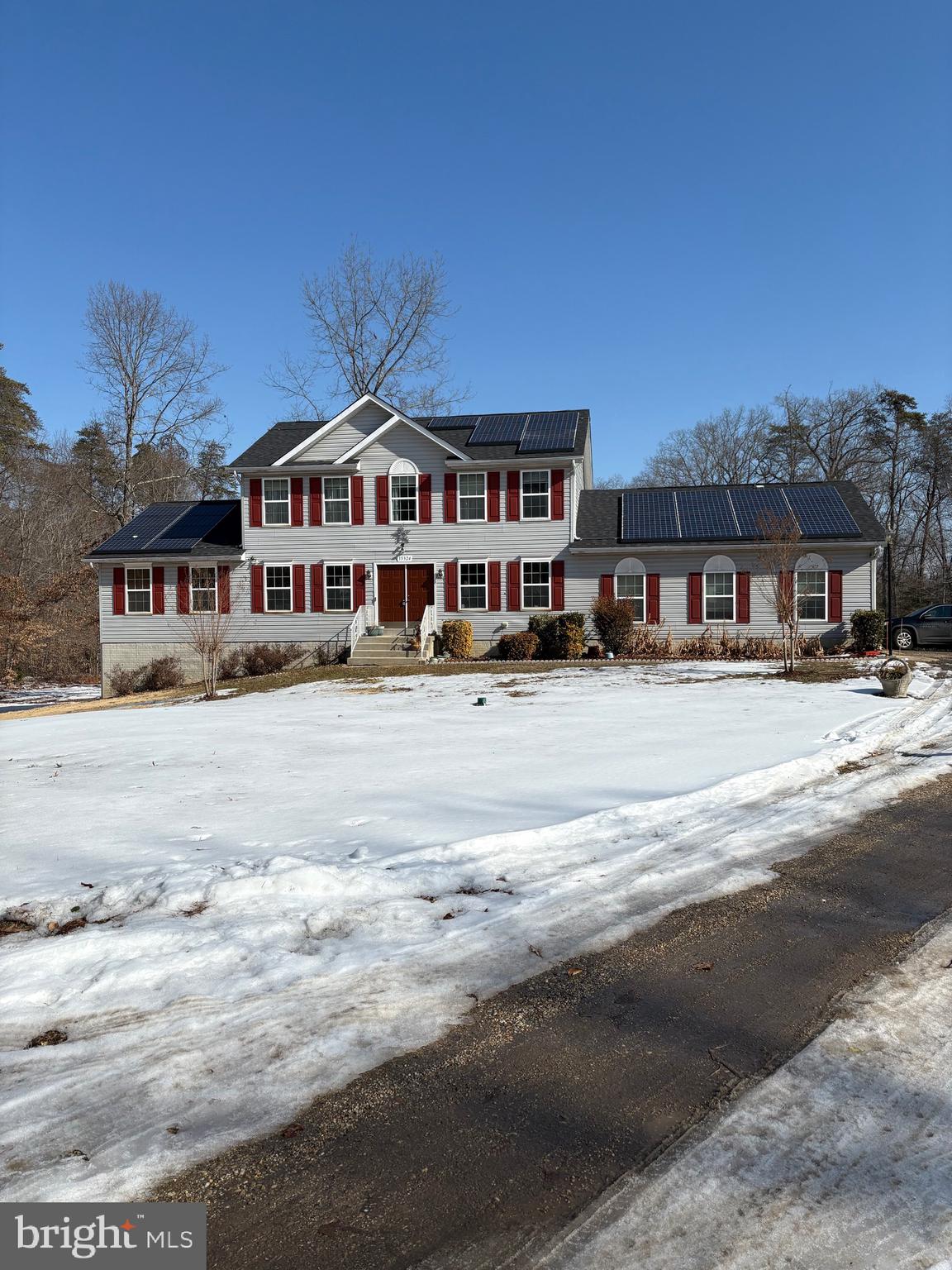 a front view of a building with a road