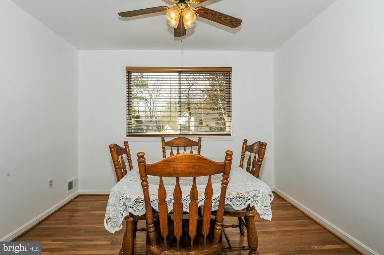 6910 Vancouver Road Springfield, VA 22152 - Photo 5 of 28 a view of a dining room with furniture and wooden floor