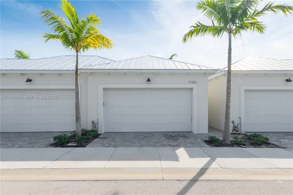 a front view of a house with garage