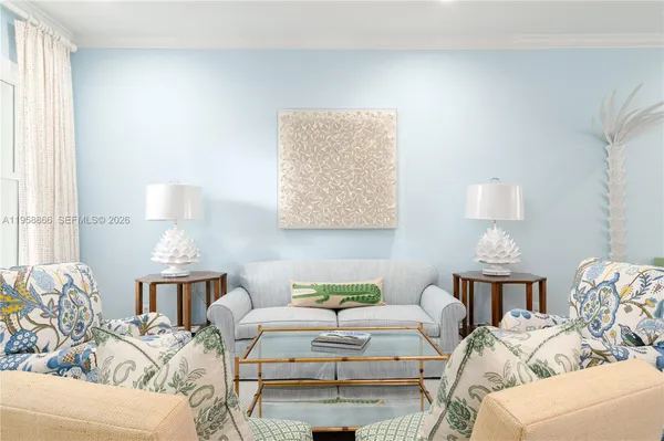 a living room with furniture a lamp and a window