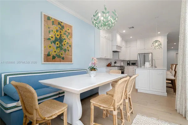 a dining room with furniture and window