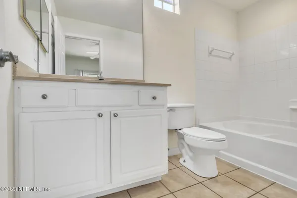 a bathroom with a toilet a sink and bathtub