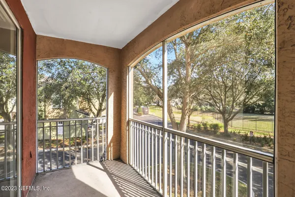 a view of a room with wooden floor and chair