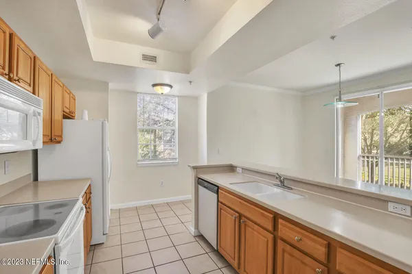 a bathroom with a sink and a large mirror